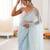 Sky blue chiffon embellished saree with unstitched blouse piece.