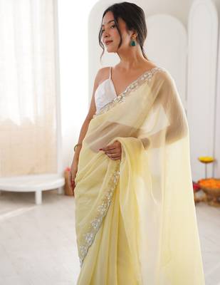 Yellow chiffon embellished saree with unstitched blouse piece. 2