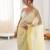 Yellow chiffon embellished saree with unstitched blouse piece.