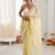 Yellow chiffon embellished saree with unstitched blouse piece.
