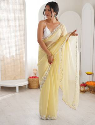 Yellow chiffon embellished saree with unstitched blouse piece. 3
