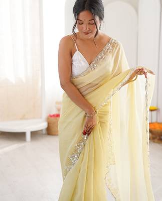 Yellow chiffon embellished saree with unstitched blouse piece. 4