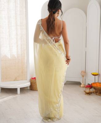 Yellow chiffon embellished saree with unstitched blouse piece. 5
