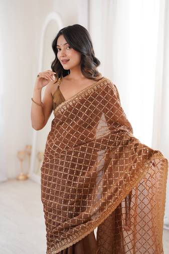 Brown chiffon embroidered saree with unstitched blouse piece.