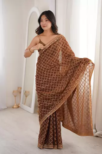 Brown chiffon embroidered saree with unstitched blouse piece.