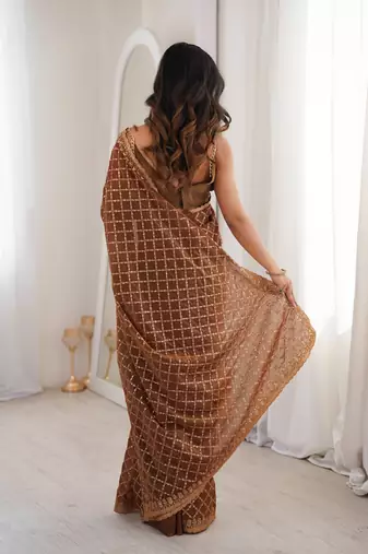 Brown chiffon embroidered saree with unstitched blouse piece.