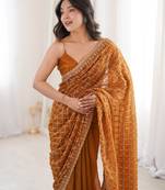 Mustard chiffon embroidered saree with unstitched blouse piece.