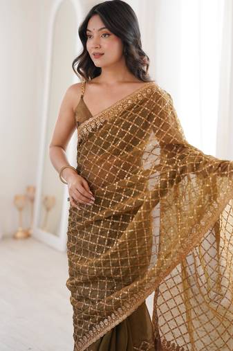 Olive chiffon embroidered saree with unstitched blouse piece.