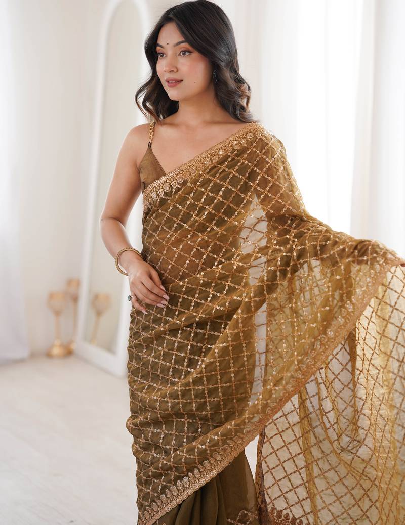 Olive chiffon embroidered saree with unstitched blouse piece.