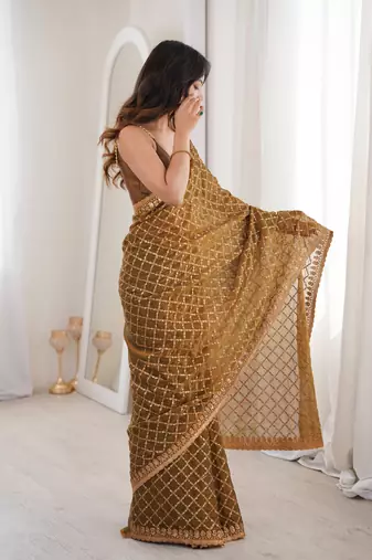 Olive chiffon embroidered saree with unstitched blouse piece.