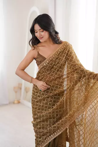 Olive chiffon embroidered saree with unstitched blouse piece.