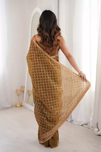 Olive chiffon embroidered saree with unstitched blouse piece.