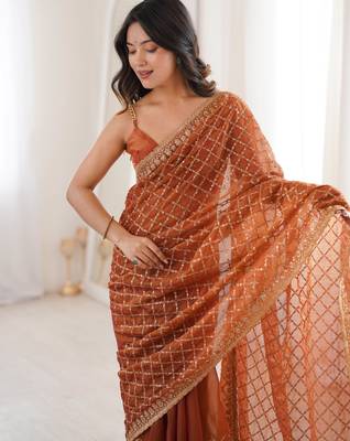 Orange chiffon embroidered saree with unstitched blouse piece. 1