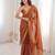 Orange chiffon embroidered saree with unstitched blouse piece.