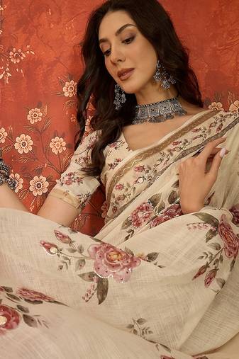 Cream linen gota patti saree with unstitched blouse piece.