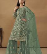 Sea green net fabric embroidered salwar kameez