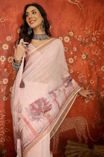 Baby pink linen embellished saree with unstitched blouse piece.