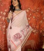 Baby pink linen embellished saree with unstitched blouse piece.