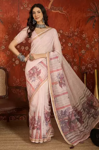 Baby pink linen embellished saree with unstitched blouse piece.