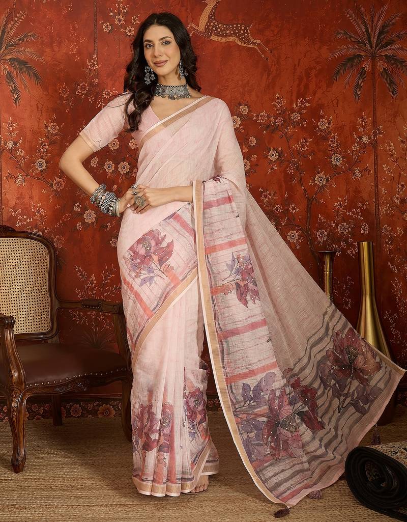 Baby pink linen embellished saree with unstitched blouse piece.