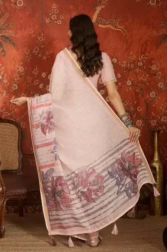 Baby pink linen embellished saree with unstitched blouse piece.