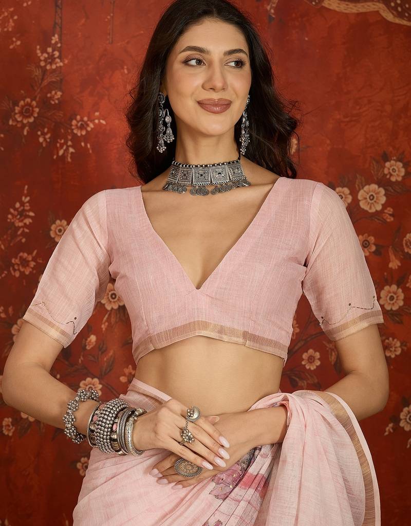 Baby pink linen embellished saree with unstitched blouse piece.