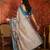 Beige linen gota patti saree with unstitched blouse piece.