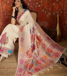 cream pashmina silk blend woven saree with unstitched blouse piece.