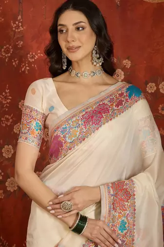 cream pashmina silk blend woven saree with unstitched blouse piece.