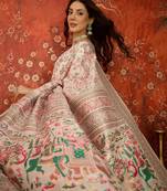 cream pashmina silk blend woven saree with unstitched blouse piece.