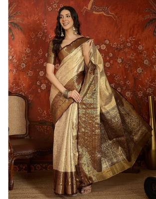 cream kanjeevaram silk blend woven design saree with unstitched blouse piece. 1