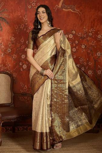 Cream kanjeevaram silk woven design saree with unstitched blouse piece.