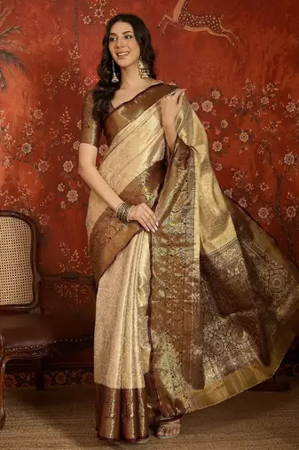 cream kanjeevaram silk blend woven design saree with unstitched blouse piece.