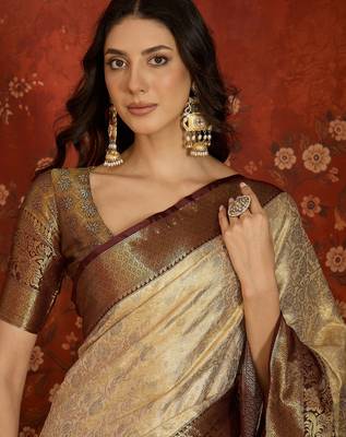 cream kanjeevaram silk blend woven design saree with unstitched blouse piece. 3