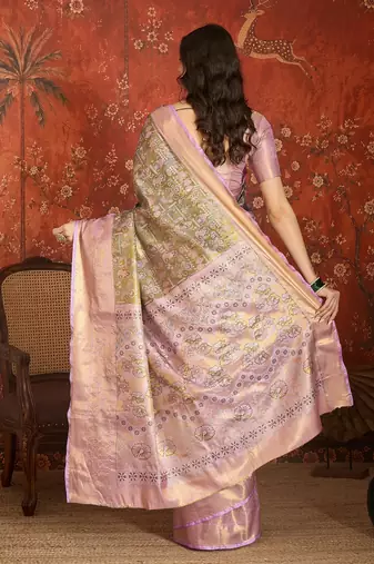 olive kanjeevaram silk blend woven design saree with unstitched blouse piece.