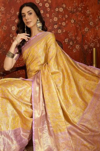 yellow kanjeevaram silk blend woven design saree with unstitched blouse piece.