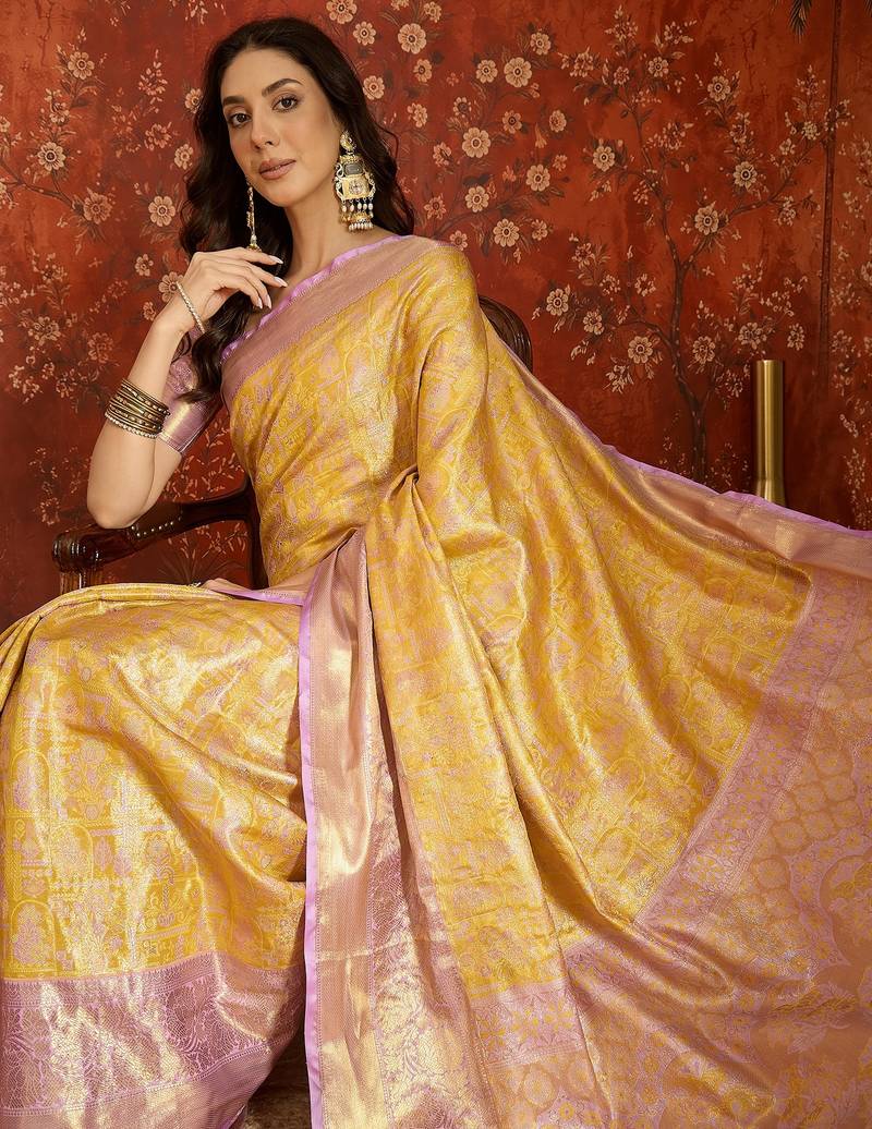 yellow kanjeevaram silk blend woven design saree with unstitched blouse piece.