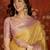 yellow kanjeevaram silk blend woven design saree with unstitched blouse piece.