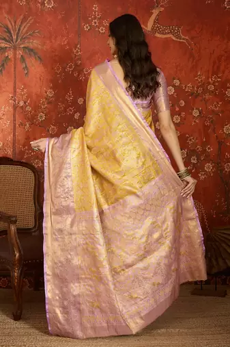 yellow kanjeevaram silk blend woven design saree with unstitched blouse piece.