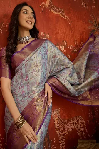 sky blue kanjeevaram silk blend woven design saree with unstitched blouse piece.