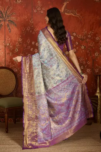 sky blue kanjeevaram silk blend woven design saree with unstitched blouse piece.