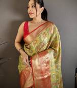 green kanjeevaram silk blend zari woven saree with unstitched blouse piece.