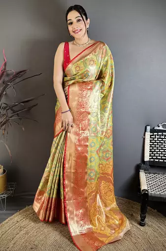 green kanjeevaram silk blend zari woven saree with unstitched blouse piece.