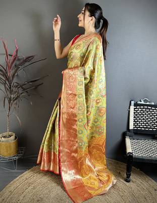green kanjeevaram silk blend zari woven saree with unstitched blouse piece. 3