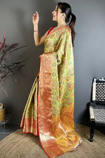 green kanjeevaram silk blend zari woven saree with unstitched blouse piece.