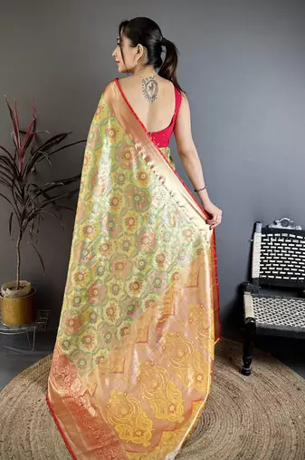 green kanjeevaram silk blend zari woven saree with unstitched blouse piece.