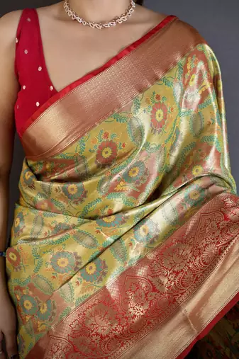 green kanjeevaram silk blend zari woven saree with unstitched blouse piece.