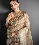 beige slub cotton blend printed saree with unstitched blouse piece.