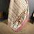 beige slub cotton blend printed saree with unstitched blouse piece.
