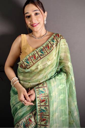 green slub cotton blend printed saree with unstitched blouse piece.